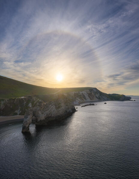 Aerial view of Durdle Door at sunrise with halo effect, Durdle Door, Jurassic Coast, Dorset, United kingdom, Northern Europe