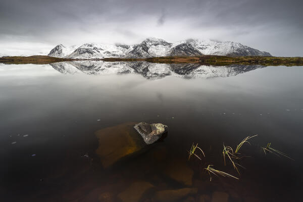 Mountain reflections at Gimsoysand during stormy weather, Vagan, Nordland, Lofoten, Norway, Northern Europe