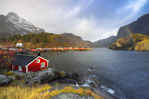 Rourbuer of Nusfjord at sunset with rainbow, Flakstad, Flakstadoya, Nordland, Lofoten, Norway, Northern Europe