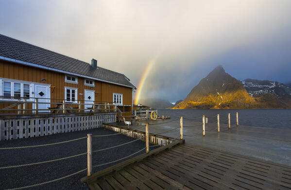 Pier in front of Sakrisoy and Olstind with rainbow, Moskenes, Moskenesoya, Nordland, Lofoten, Norway, Northern Europe