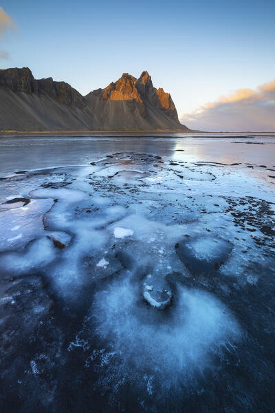 Vestrahorn and frozen black sand at sunset, Stokksnes peninsula, Hofn, Austurland, Iceland, Northern Europe