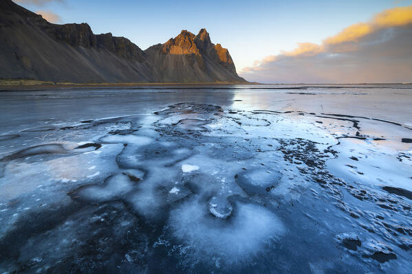 Vestrahorn and frozen black sand at sunset, Stokksnes peninsula, Hofn, Austurland, Iceland, Northern Europe