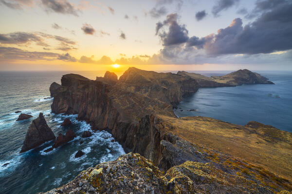 Warm light of the sunrise at Sao Lourenco peninsula from Miradouro de Abismo, Madeira, Portugal, Western Europe