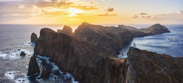 Aerial view of a tourist at Miradouro do Abismo during sunrise, Sao Lourenco peninsula, Madeira, Portugal, Western Europe