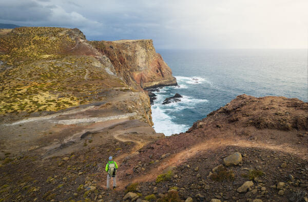A tourist at Miradouro do Abismo, Sao Lourenco peninsula, Madeira, Portugal, Western Europe