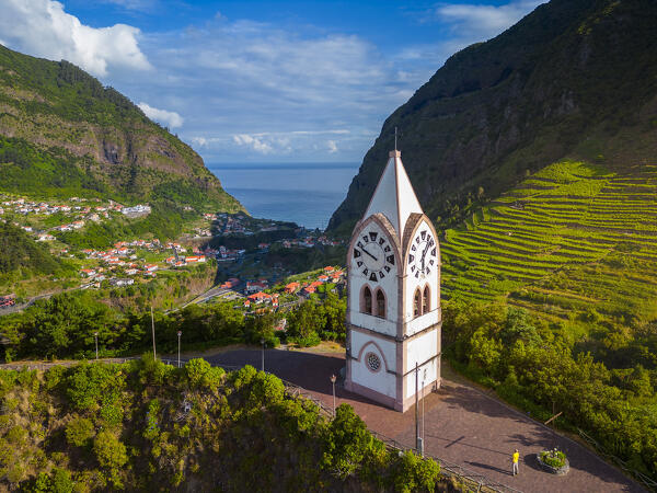 Aerial view of a tourist at Capelinha de Nossa Senhora de Fatima surrounded by terraced fields at sunrise, Sao Vicente, Madeira, Portugal, Europe (MR)