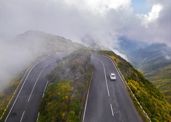 Aerial view of a car along the road of Lombo do Mouro, Serra de Agua, Madeira, Portugal, Europe