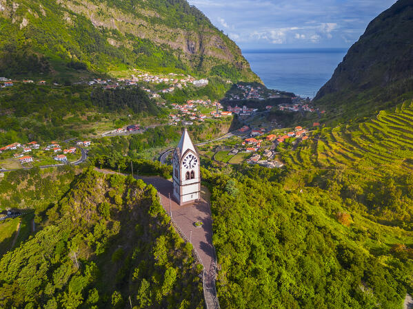 Aerial view of Capelinha de Nossa Senhora de Fatima surrounded by terraced fields at sunrise, Sao Vicente, Madeira, Portugal, Europe