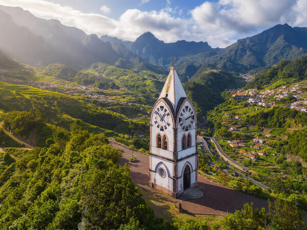 Aerial view of Capelinha de Nossa Senhora de Fatima surrounded by terraced fields at sunrise, Sao Vicente, Madeira, Portugal, Europe