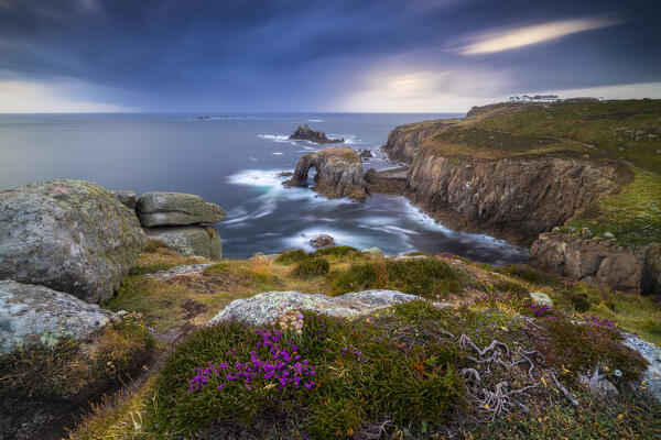 Enys Dodnan Arch and Longships lighthouse at sunset, Land’s End, Cornwall, England, Great Britain, United Kingdom