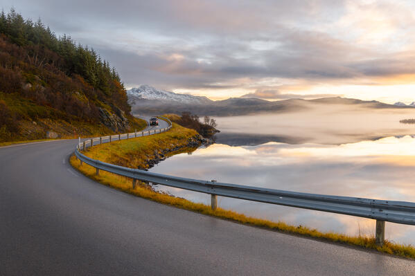 A car along along the road to Uttakleiv beach during sunset, Leknes, Vestvagoy, Nordland, Lofoten Islands, Norway, Northern Europe