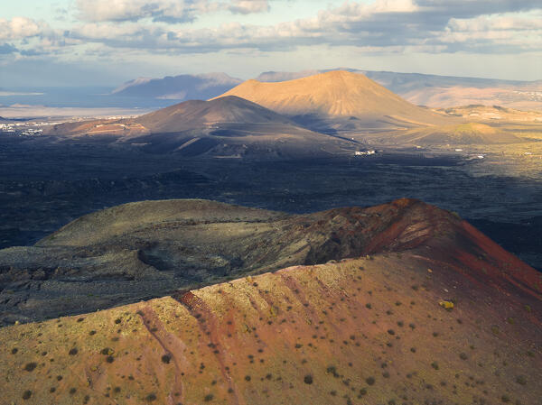 Aerial view of the crater of Caldera Colorada at sunset and Caldera Blanca in the background, Tinajo, Las Palmas, Lanzarote, Canary Islands, Macaronesia, Spain, Western Europe