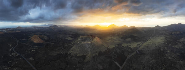 Panoramic and Aerial view of the crater of Caldera Colorada at sunrise, Tinajo, Las Palmas, Canary Islands, Macaronesia, Spain, Western Europe