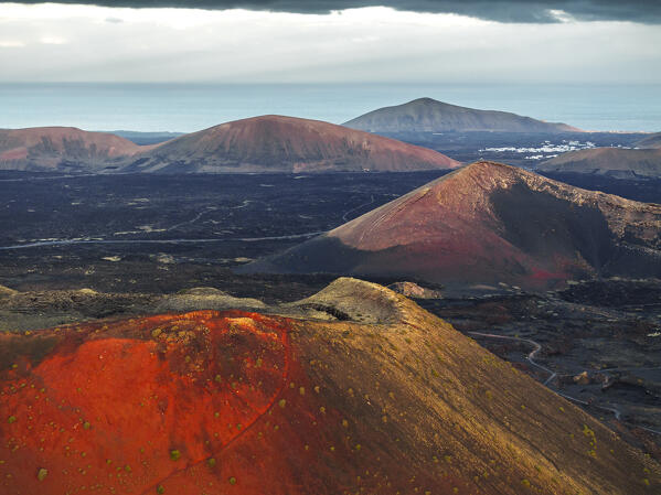 Aerial view of the crater of Caldera Colorada and lava fields, Tinajo, Las Palmas, Canary Islands, Macaronesia, Spain, Western Europe