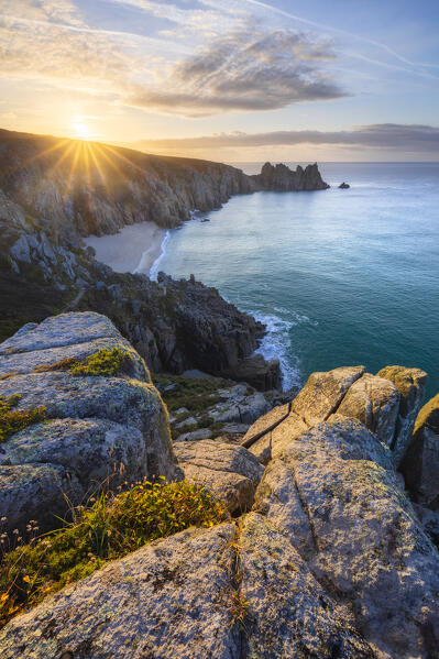 Logan Rock and Pedn Vounder beach at sunrise, St Levan, Treen, Penzance, Cornwall, England, Great Britain, United Kingdom