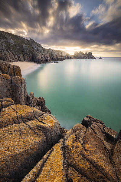 Logan Rock and Pedn Vounder beach at sunrise, St Levan, Treen, Penzance, Cornwall, England, Great Britain, United Kingdom