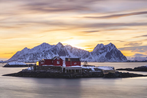 Lone cottage at sunrise in Svolvaer with mountains in background, Vagan, Austagoy, Nordland, Lofoten, Norway, Northern Europe 
