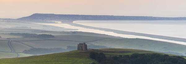 St Catherine’s Chapel and Chesil Beach viewed from hills around Abbotsbury, Dorset, United Kingdom, Northern Europe 