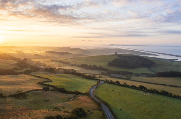 Aerial view of St Catherine’s Chapel and Chesil Beach viewed from hills around Abbotsbury, Dorset, United Kingdom, Northern Europe 