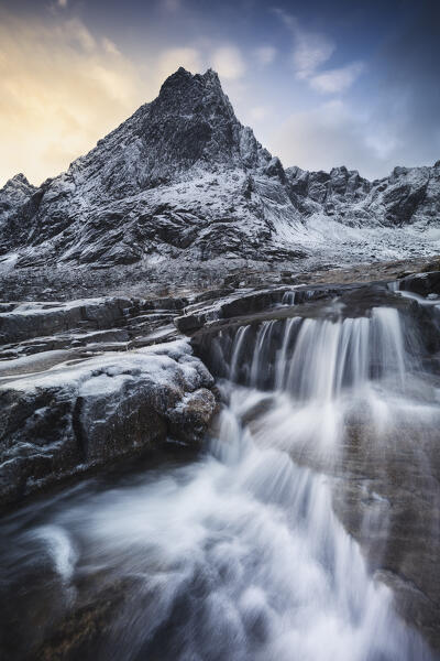 Dusk and waterfalls in a fjord near Flakstad, Flakstadoya, Nordland, Lofoten, Norway, Northern Europe