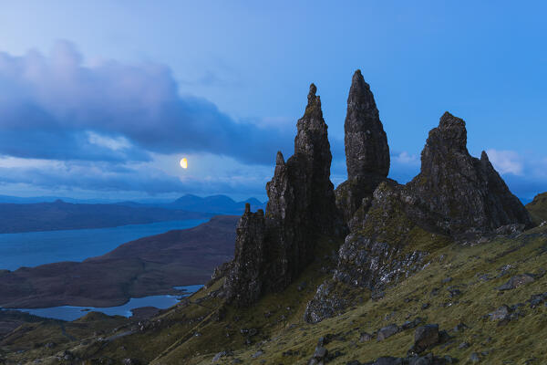 Old Man of Storr with moon during blue hour, Isle of Skye, Inner Hebrides, Trotternish peninsula, Highlands, Scotland, United Kingdom