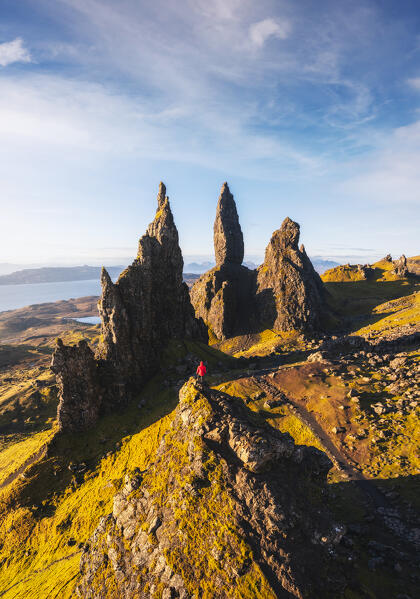 Aerial view of a tourist at Old Man of Storr during sunrise, Isle of Skye, Inner Hebrides, Trotternish peninsula, Highlands, Scotland, United Kingdom