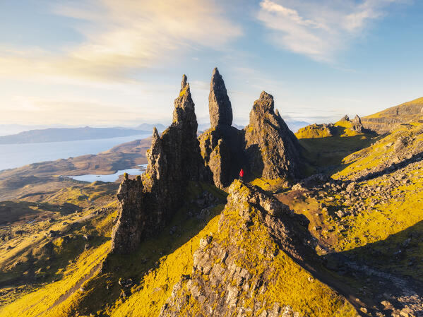 Aerial view of a tourist at Old Man of Storr during sunrise, Isle of Skye, Inner Hebrides, Trotternish peninsula, Highlands, Scotland, United Kingdom