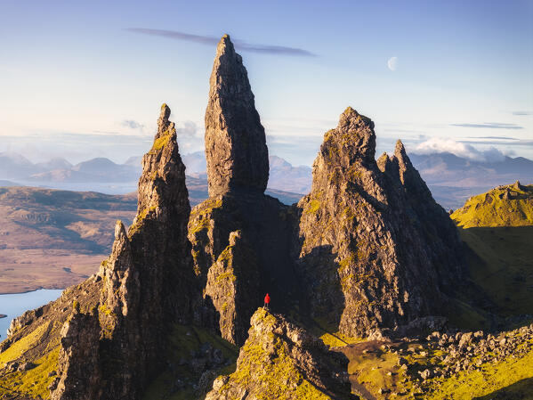 Aerial view of a tourist at Old Man of Storr during sunrise, Isle of Skye, Inner Hebrides, Trotternish peninsula, Highlands, Scotland, United Kingdom