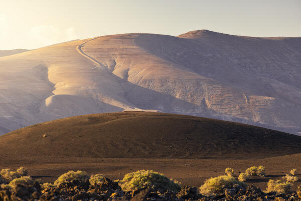 Lava fields and volcanoes of Timanfaya National Park during sunrise, Yaiza, Las Palmas, Timanfaya National Park, Lanzarote, Canary Islands, Macaronesia, Spain, Western Europe