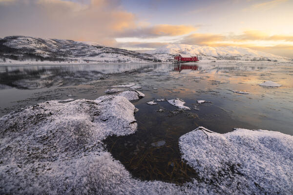 House and mountains at Austre Kanstad during winter sunset, Lodingen, Nordland, Lofoten Islands, Norway, Northern Europe
