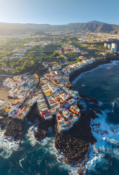 Aerial view of colorful houses in Punta Brava during sunrise with Teide in the background, Puerto de La Cruz, Tenerife, Canary Islands, Macaronesia, Spain, Western Europe