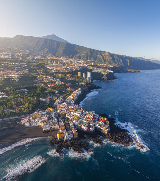 Aerial view of colorful houses in Punta Brava during sunrise with Teide in the background, Puerto de La Cruz, Tenerife, Canary Islands, Macaronesia, Spain, Western Europe