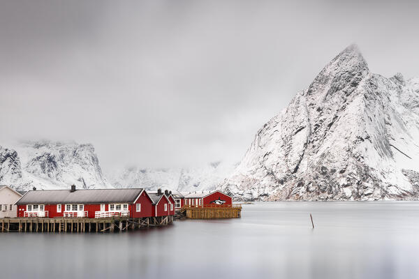 View of Hamnoy during a cloudy day with Olstinden in the background, Hamnoy, Moskenes, Moskenesoya, Nordland, Lofoten, Norway, Northern Europe