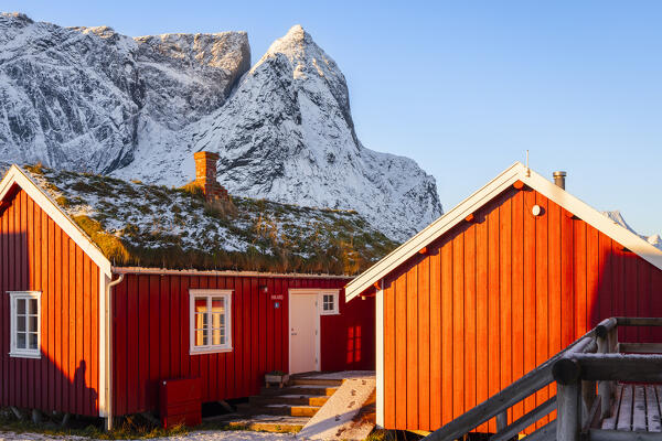 Rorbuer and mountains at Reine during winter sunset, Moskenes, Moskenesoya, Nordland, Lofoten, Norway, Northern Europe