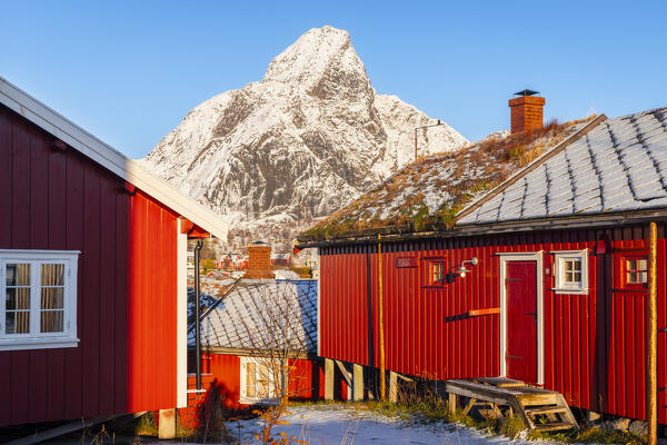 Rorbuer and Olstinden at Reine during winter sunset, Moskenes, Moskenesoya, Nordland, Lofoten, Norway, Northern Europe