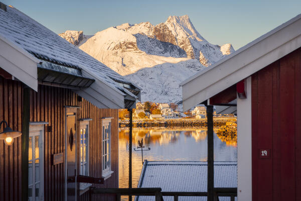 Rorbuer and mountains at Reine during winter sunset, Moskenes, Moskenesoya, Nordland, Lofoten, Norway, Northern Europe