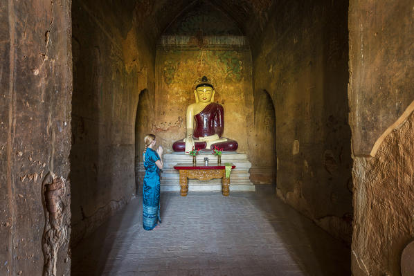 Praying in Tayoke Pyay Temple, Bagan, Myanmar, Southeast Asia