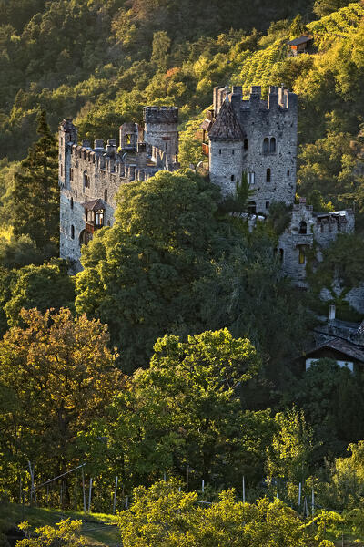 Castel Fontana/Brunnenburg has medieval origins but was rebuilt in neo-gothic style in the twentieth century. Tirol/Tirolo, Bolzano province, Trentino Alto-Adige, Italy, Europe.