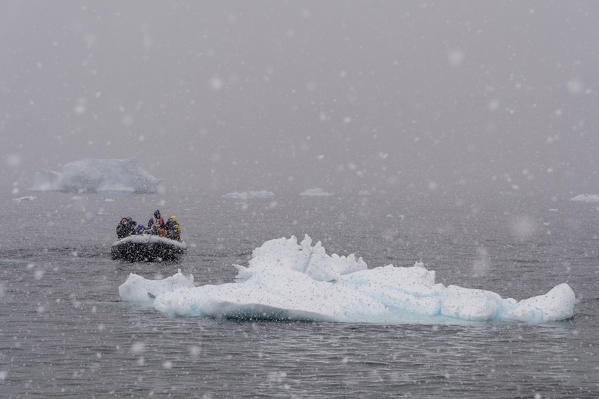 A snowstorm hits tourist in Portal Point, Antarctica.