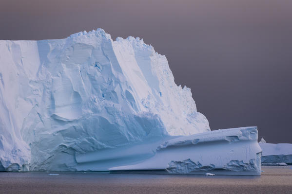 Icebergs under a stormy sky, Lemaire channel, Antarctica.