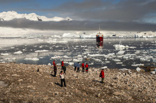 Antarctica, Antarctic Peninsula, Gerlache strait, Neko Harbor, Antarctic Dream ship and tourists on shore, MR.