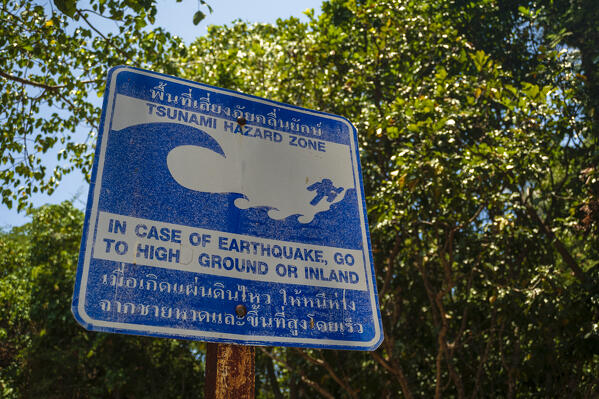 A tsunami evacuation route sign, Ko Kradan, Talay Trang archipelago, Thailand.