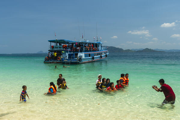 Local tourist visiting Ko Kradan, Talay Trang archipelago, Thailand.