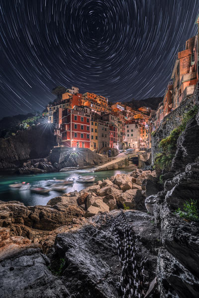 Night and Startrail on the village of Riomaggiore, Cinque Terre, municipality of Riomaggiore, La Spezia provence, Liguria, Italy, Europe