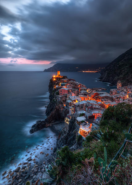 The first lights of the evening on Vernazza, National Park of Cinque Terre, municipality of Vernazza, La Spezia province, Liguria district, Italy, Europe
