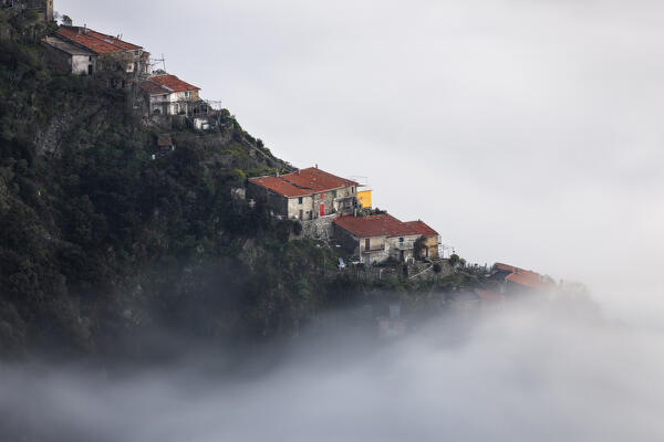 Caligo, maritime fog on the Ligurian coast and on the village of Monesteroli, La Spezia province, Liguria district, Italy, Europe