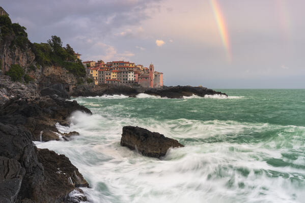 Rainbow and rough sea over the village of Tellaro, municipality of Lerici, La Spezia province, Liguria district, Italy, Europe