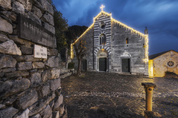 Night on the Church of San Lorenzo in Portovenere with Christmas lights, municipality of Porto Venere, La Spezia province, Liguria district, Italy, Europe
