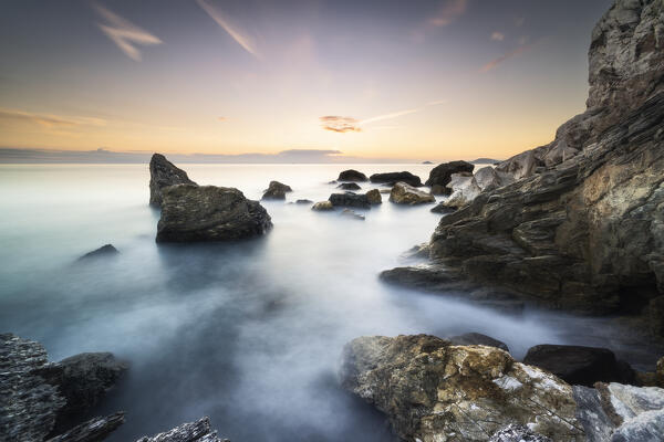 Long exposure at sunset among the rocks of Punta Corvo, municipality of Ameglia, La Spezia province, Liguria, Italy, Europe
