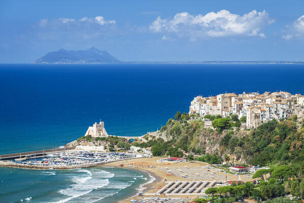 View of the white sea village of Sperlonga with the beach, the tower and the marina and the peak of Circeo mountain in the background, Sperlonga, Latina province, Latium, Central Italy, Italy, Europe